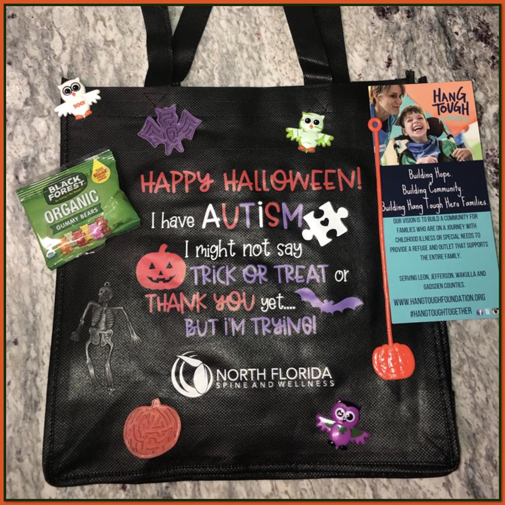 Customer photo from Kristin of our Celebration Shopping Tote Bag - 13" x 13" - Full Color, a black bag with stickers and a tag on it